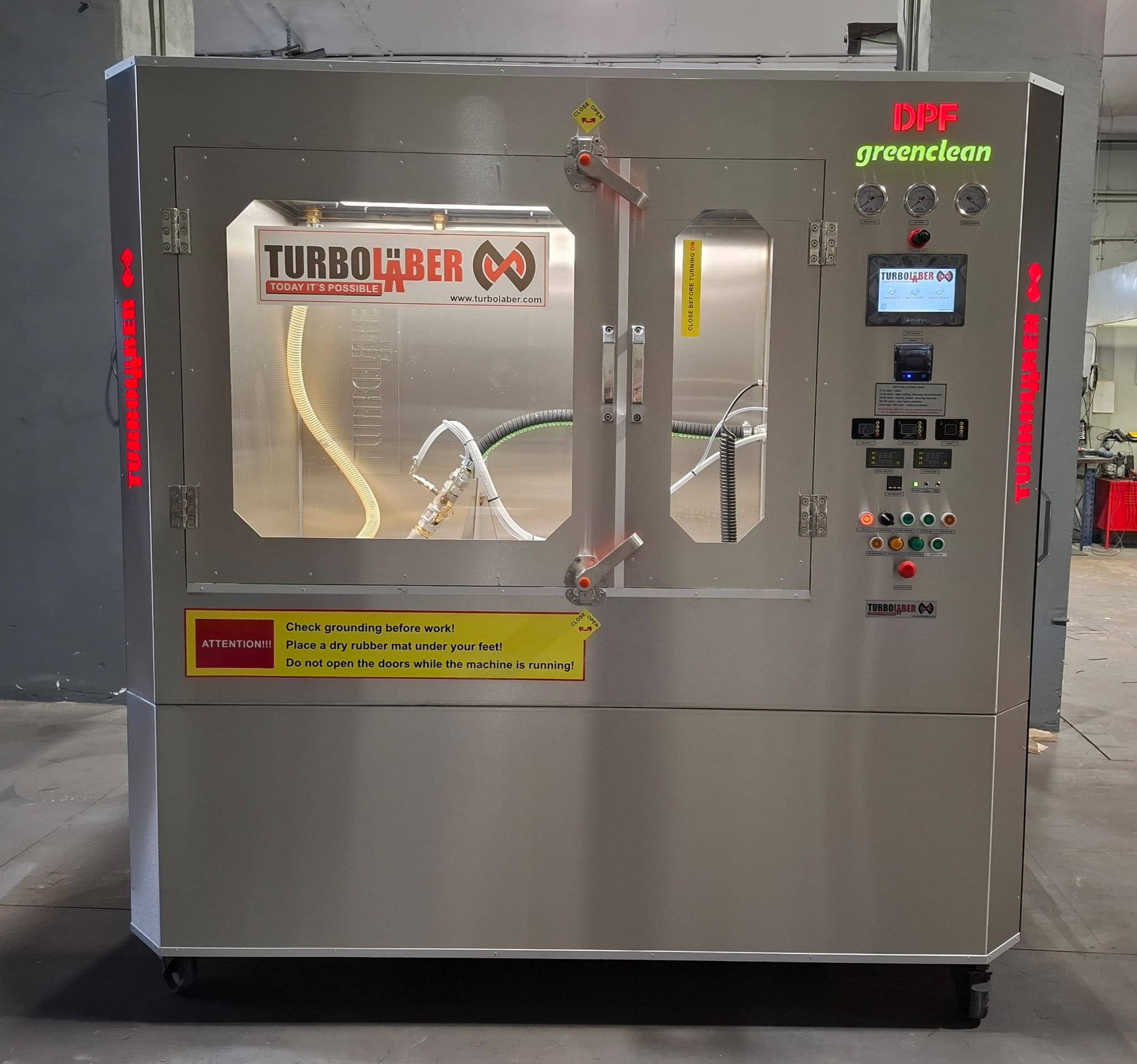 Front of the TurboLaber DPF greenclean TRUCK machine with stainless-steel cleaning chamber and touchscreen